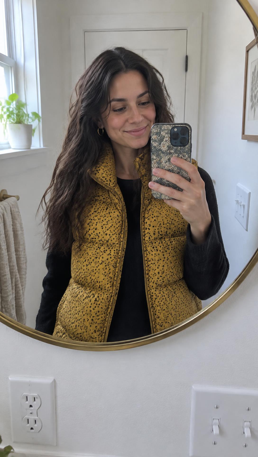 Video still: mirror selfie with a cycle phase grid overlay